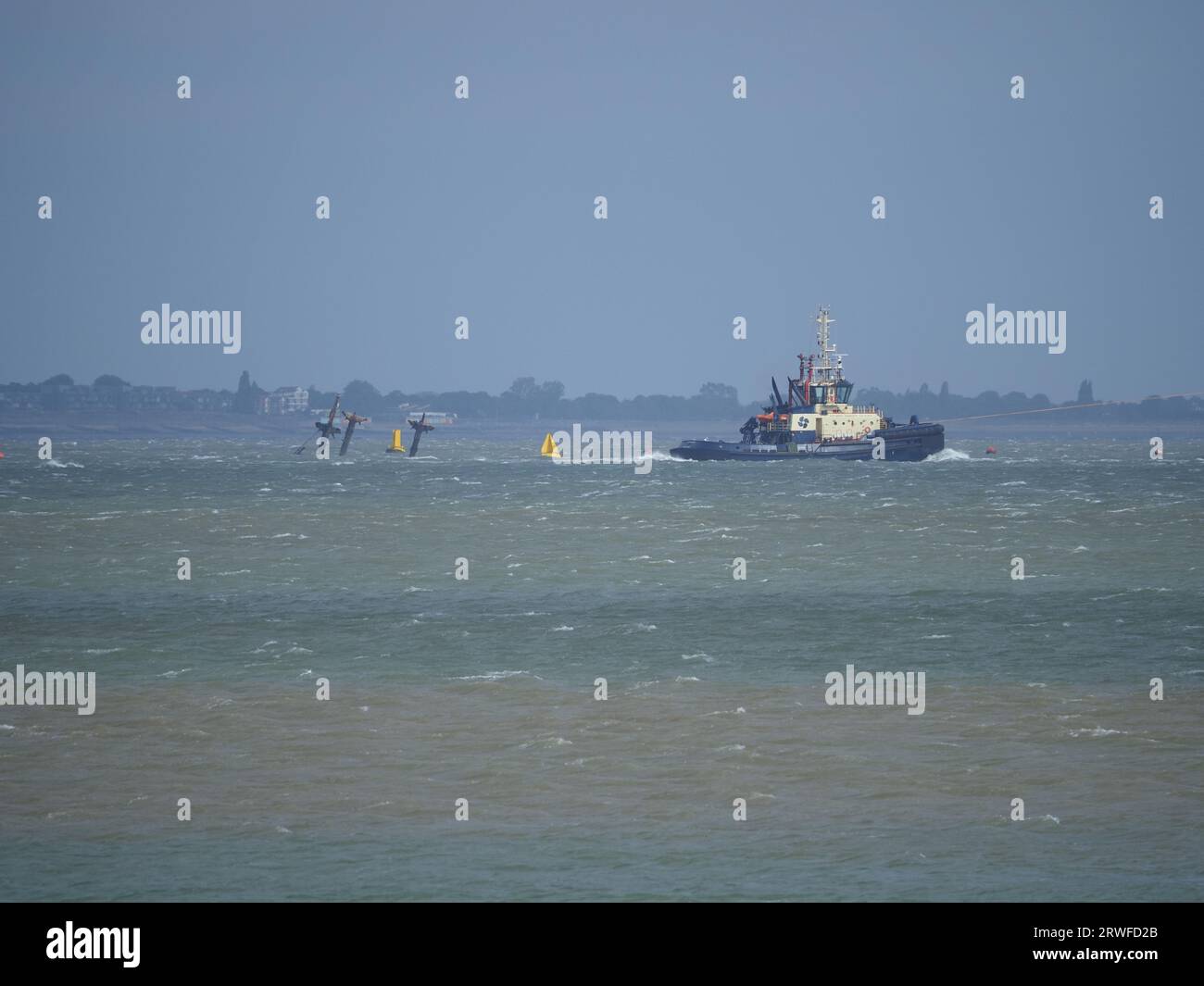 Sheerness, Kent, UK. 19th Sep, 2023. UK Weather: windy in Sheerness, Kent. Huge gas ship Cheikh el Mokrani is assisted by two Svitzer tugs (with a third on standby) as it departs Sheerness and has to navigate past WW2 ammunition shipwreck SS Richard Montgomery. Credit: James Bell/Alamy Live News Stock Photo