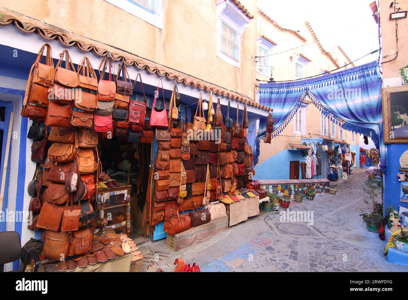 Other Shops A shop front displaying handmade leather bags outside, in a row of ...