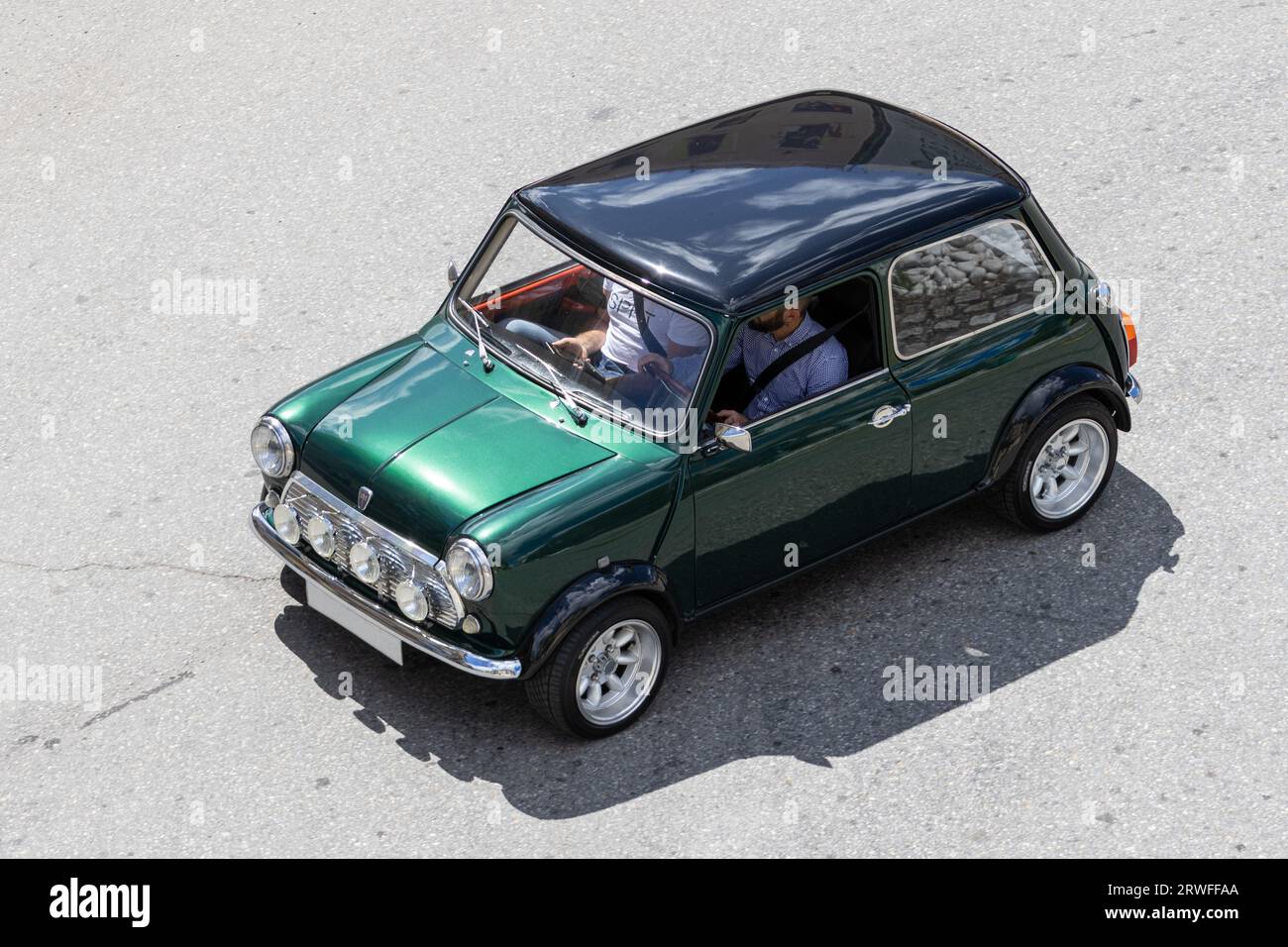 Galicia, Spain; august 27, 2023: High angle view of a Morris Mini Cooper classic car driving on a road Stock Photo