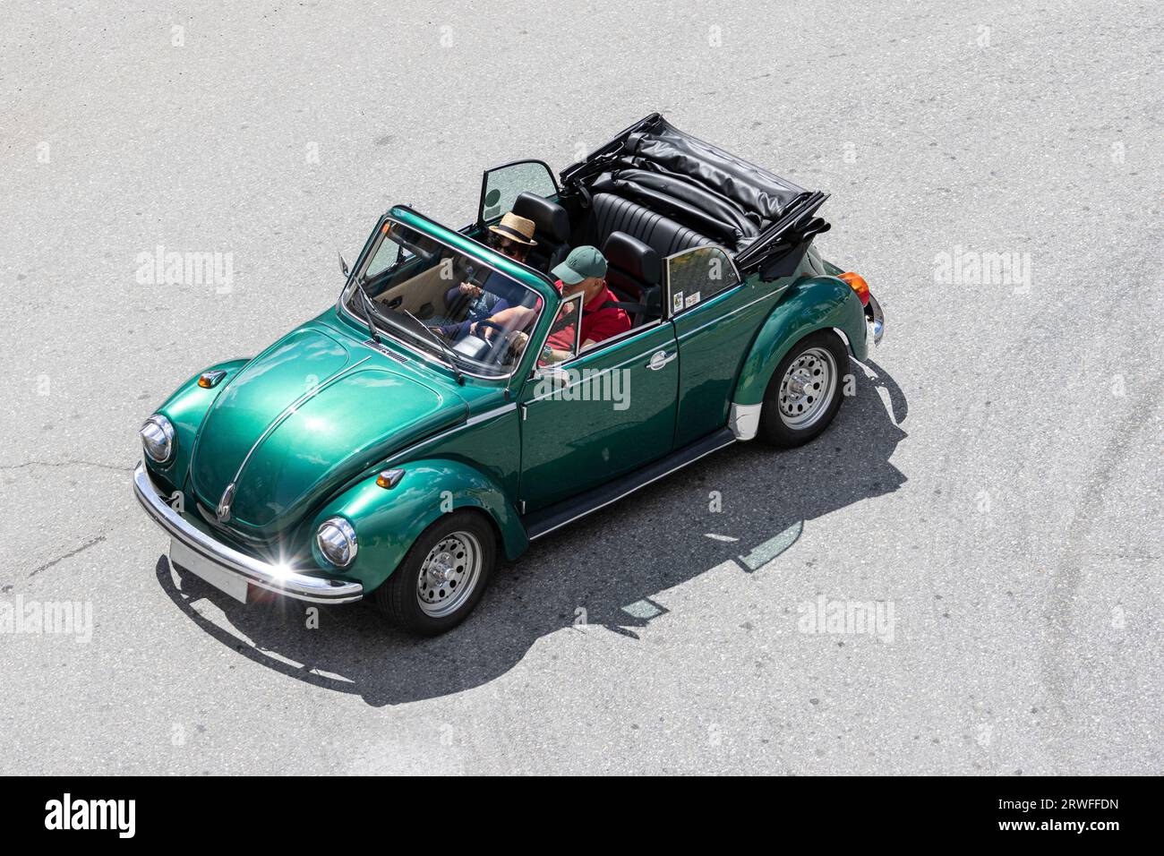 Galicia, Spain; august 27, 2023: High angle view of a classic Volkswagen Beetle Cabrio car driving on a road Stock Photo