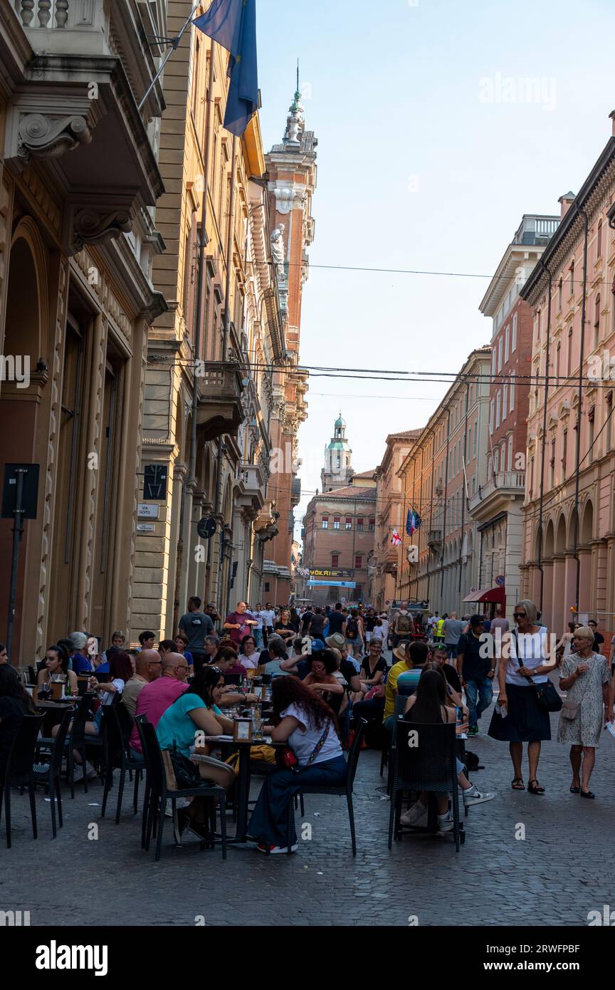 Diners and shoppers are able to enjoy shopping on Via dell'Indipendenza in safety as the one kilometre long straight Avenue is closed to traffic on we Stock Photo