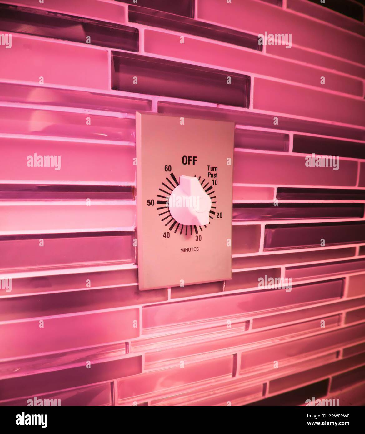 Iconic old-school wall-mounted kitchen appliance timer. Electrical ...