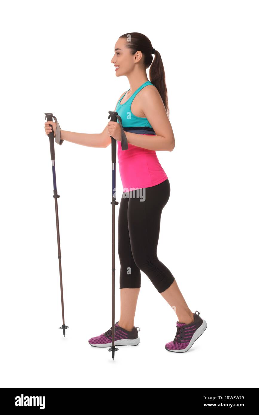 Young woman practicing Nordic walking with poles isolated on white Stock Photo