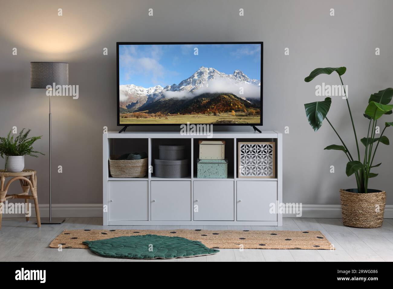 Mountain landscape on TV screen in room Stock Photo