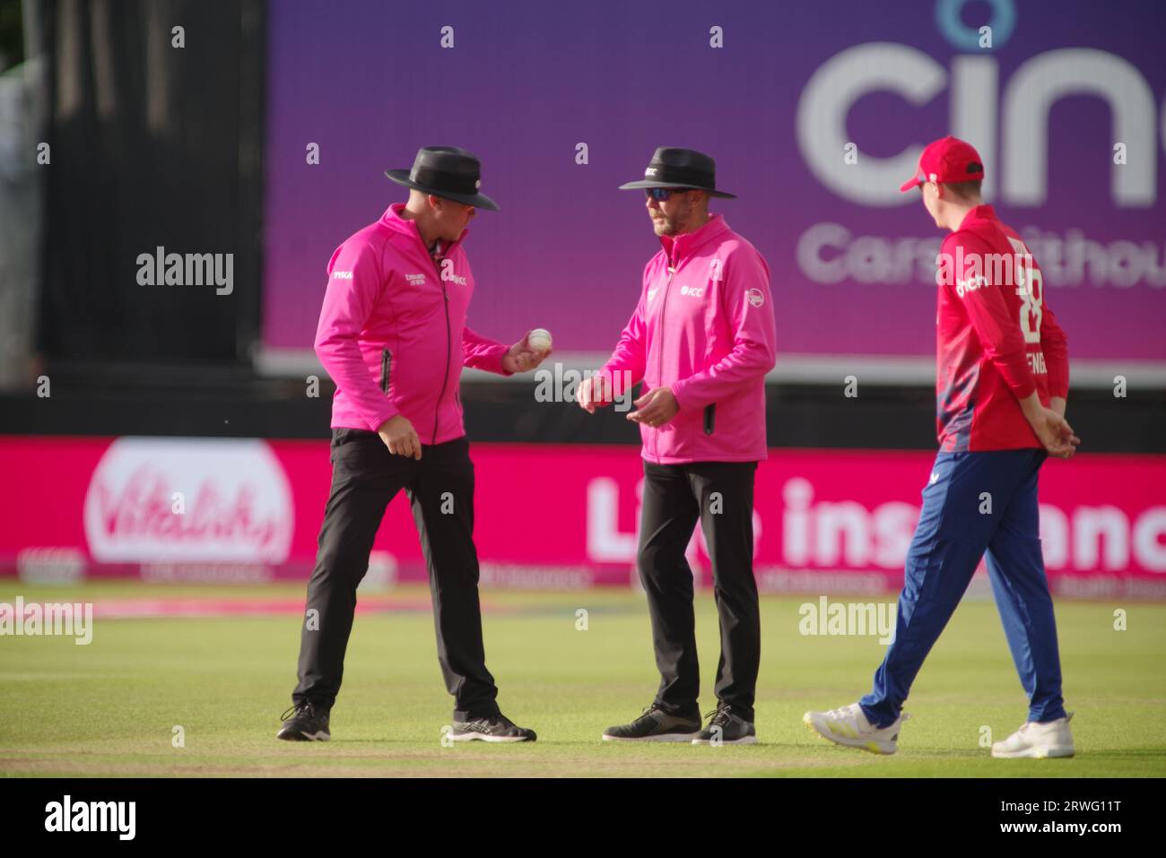 Chester le Street, 30 August 2023. Harry Brook watching Umpires Martin Saggers and Mike Burns inspect the ball during the First Vitality T20 International match between England and New Zealand at Seat Unique Riverside. Credit: Colin Edwards Stock Photo
