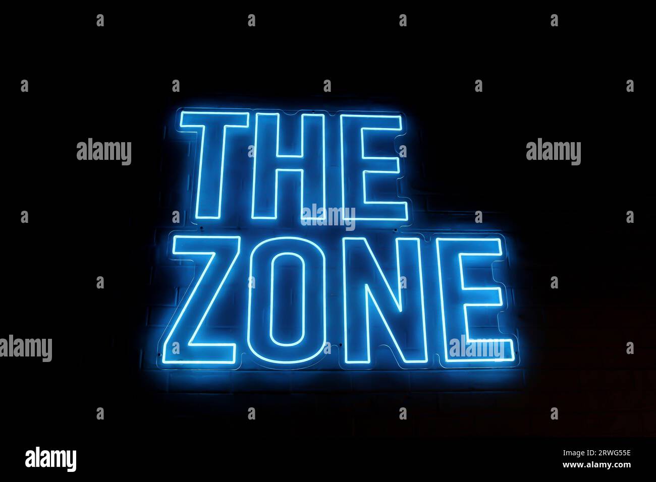 The Zone Blue Neon Sign Stock Photo Alamy
