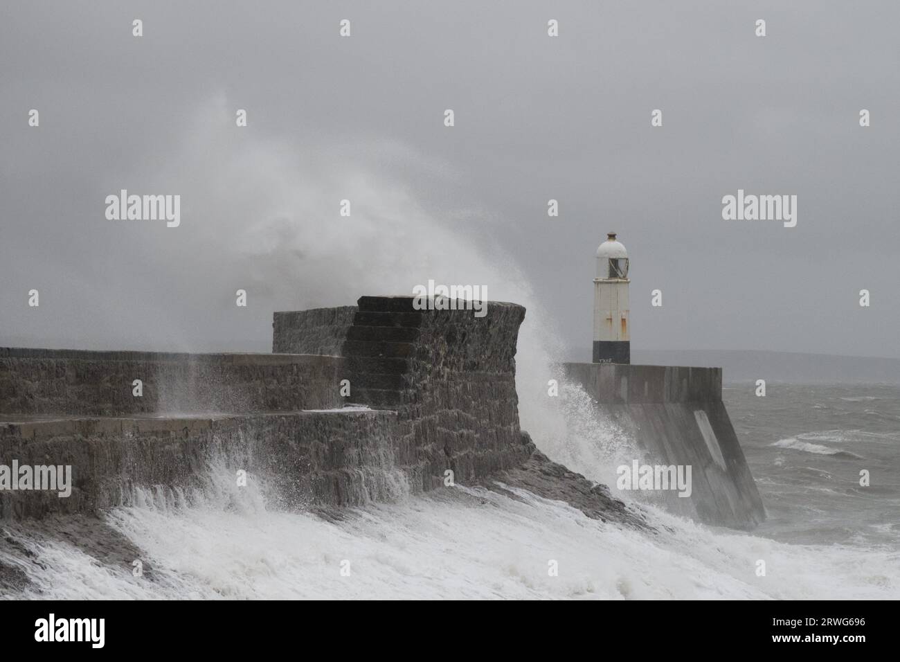 Porthcawl, South Wales, UK.  19 Sept  2023.  UK weather:  Large waves crash over the lighthouse with gales of 50 mph.  Credit: Andrew Bartlett/Alamy Live News. Stock Photo