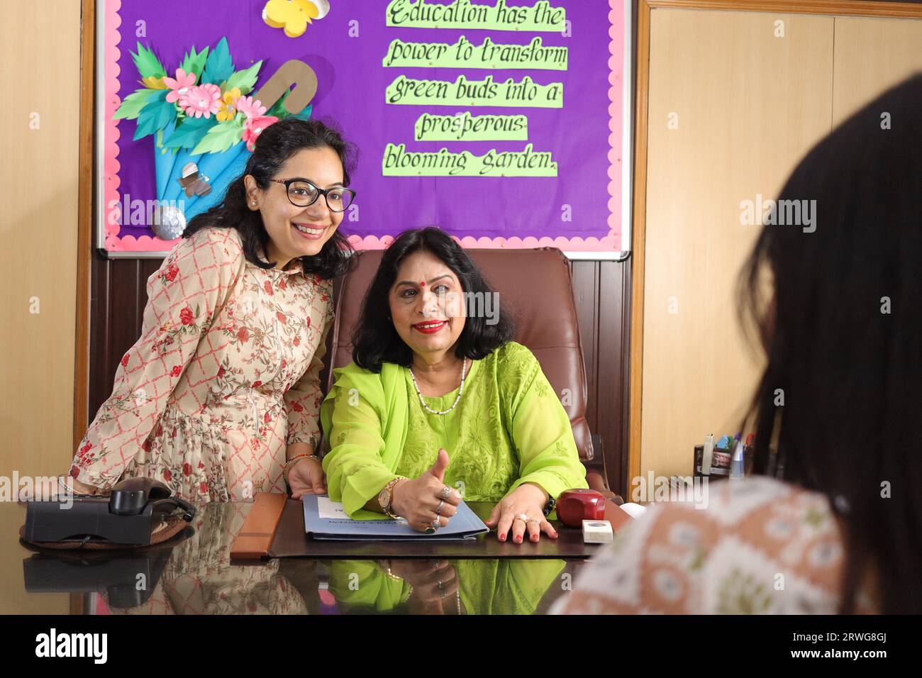 Principal mam of school with her personal assistant attending a meeting in the conference room. progress in education of children, advisor. Stock Photo
