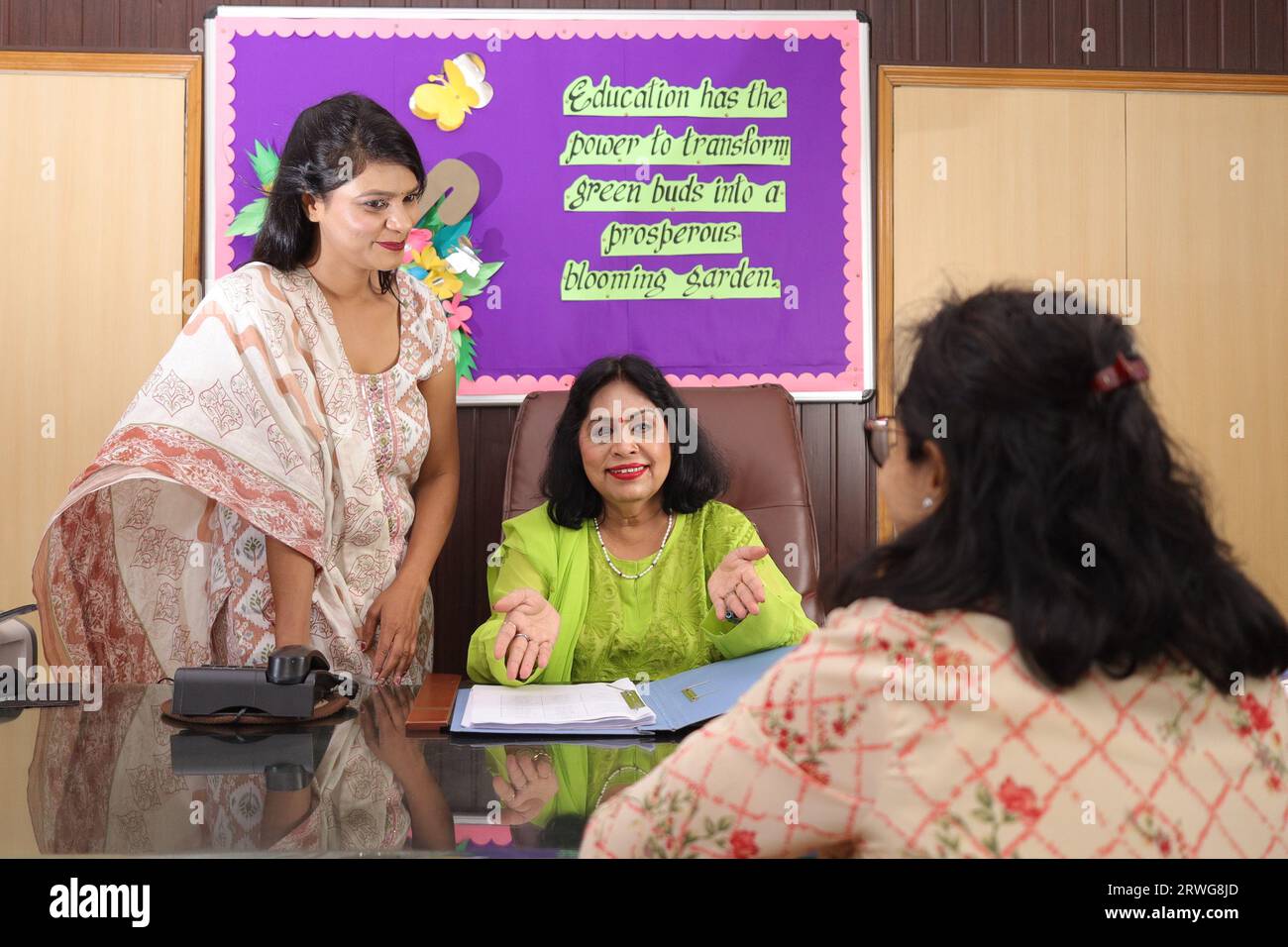 Principal mam of school with her personal assistant attending a meeting in the conference room. progress in education of children, advisor. Stock Photo