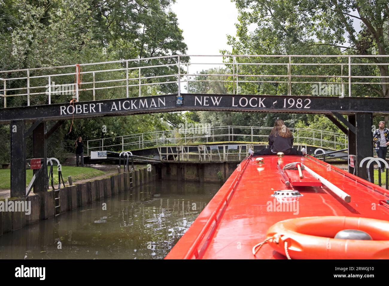 Holiday makers on barge approaching Robert Eichman bridge and lock River Avon Stock Photo