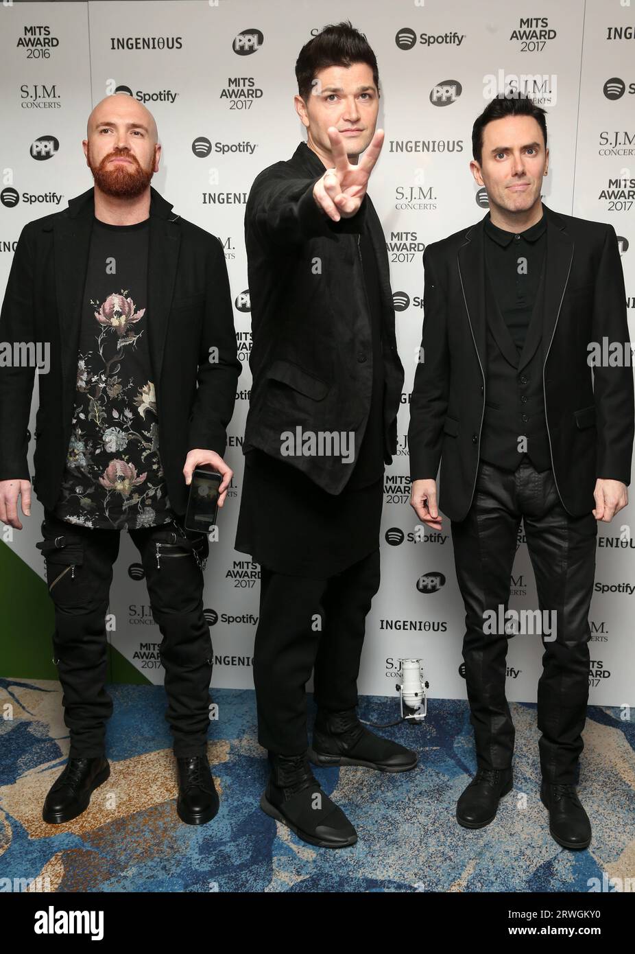 Mark Sheehan, Danny O'Donoghue and Glen Power of the band The Script attend  the 26th annual Music Industry Trust Awards held at The Grosvenor House Hotel in London, England. Stock Photo