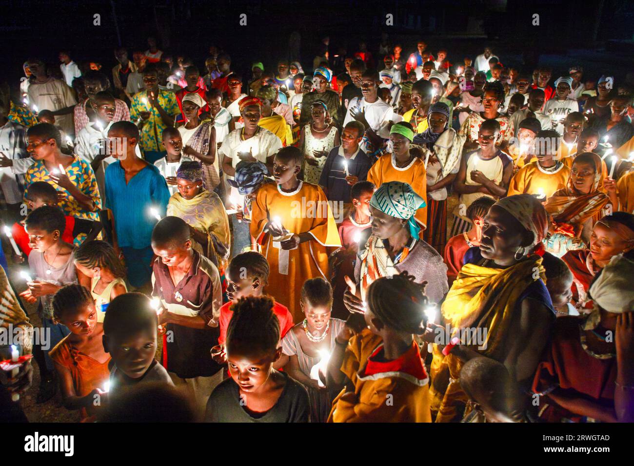 Catholic Christians hold candles during the Easter Vigil. Ethiopia, Africa. --- Gläubige Katholiken halten in der Osternacht Kerzen. Äthiopien, Afrika Stock Photo