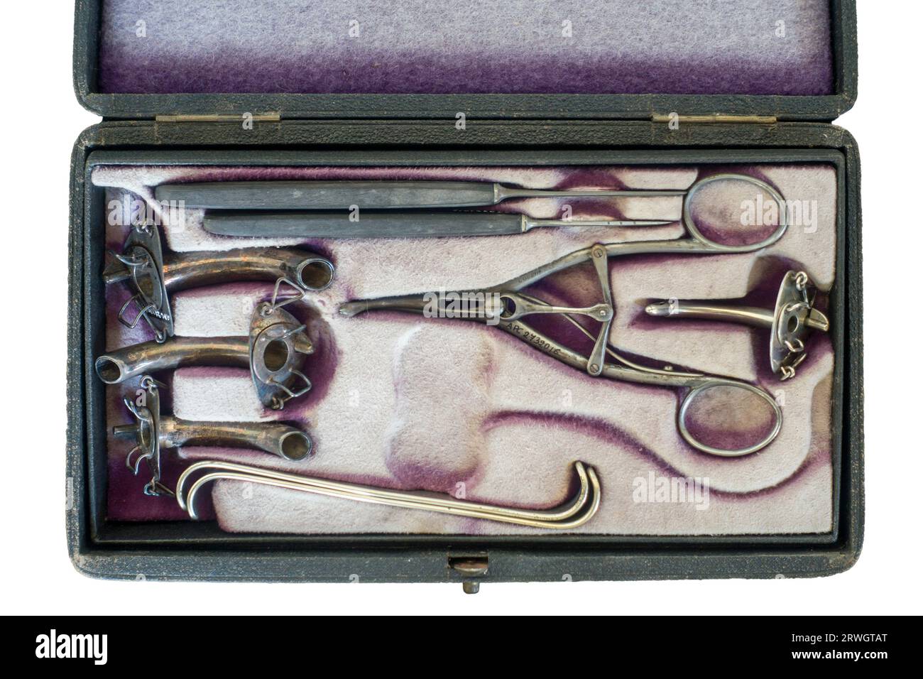 Antique tracheotomy / tracheostomy instruments in box showing tracheal tubes / tracheostomy tubes for treating severe airway obstruction Stock Photo