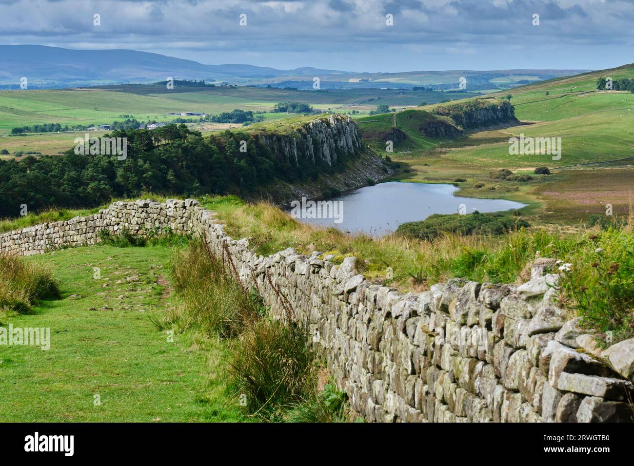 The North Pennines, Crag Lough, and HighShield Crags seen from Hotbank Crags on the Hadrian's Wall National Trail near Bardon Mill, Northumberland Stock Photo