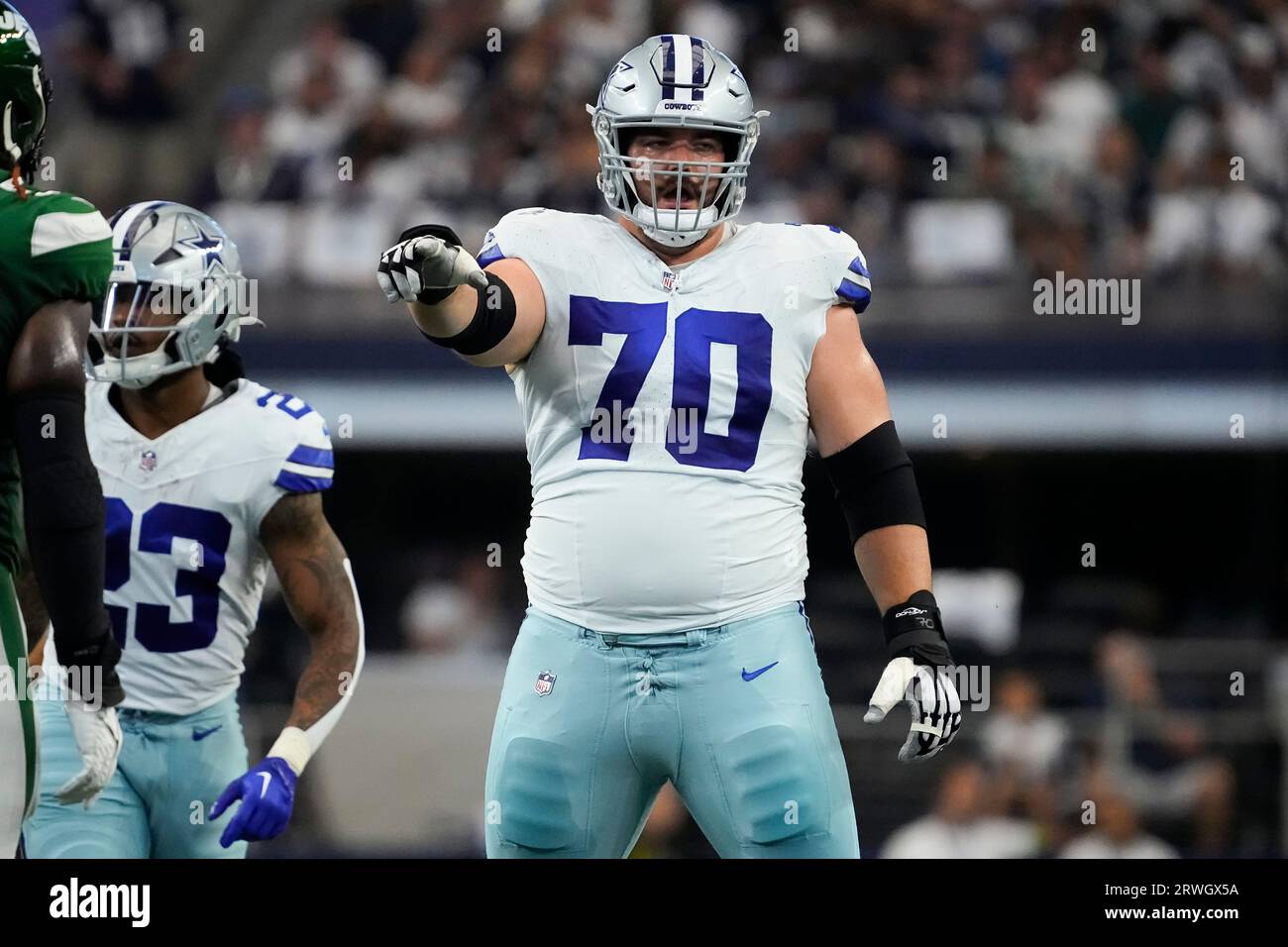 Dallas Cowboys guard Zack Martin (70) gestures at the line of