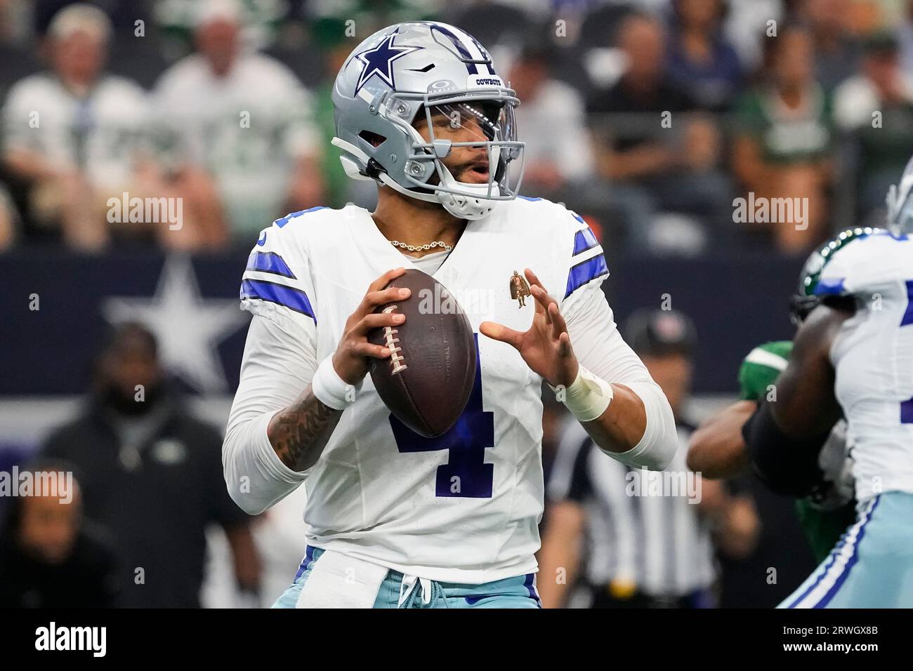 Dallas Cowboys quarterback Dak Prescott looks to pass during the first half  of an NFL football game against the New York Jets, Sunday, Sept. 17, 2023  in Arlington, Texas. (AP Photo/Sam Hodde