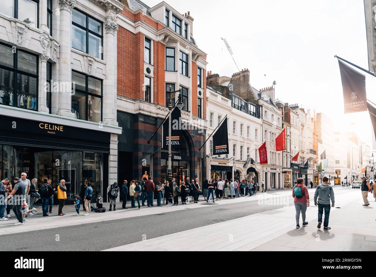 London, UK - August 27, 2023: People lining up on Bond Street to enter the Exhibition Freddie Mercury World of His Own - London. Stock Photo