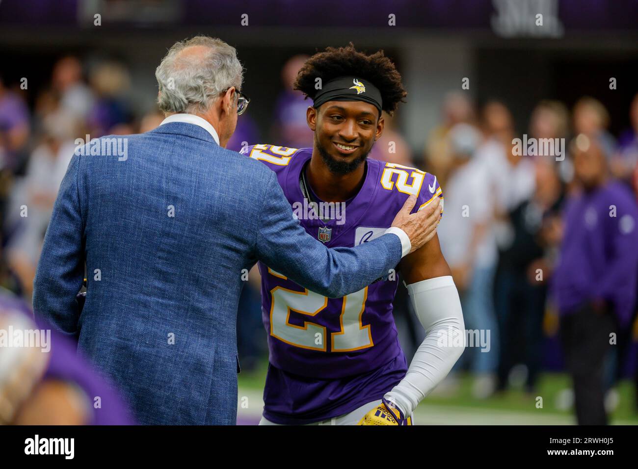 Minnesota Vikings owner Zygi Wilf, left, greets cornerback Byron Murphy