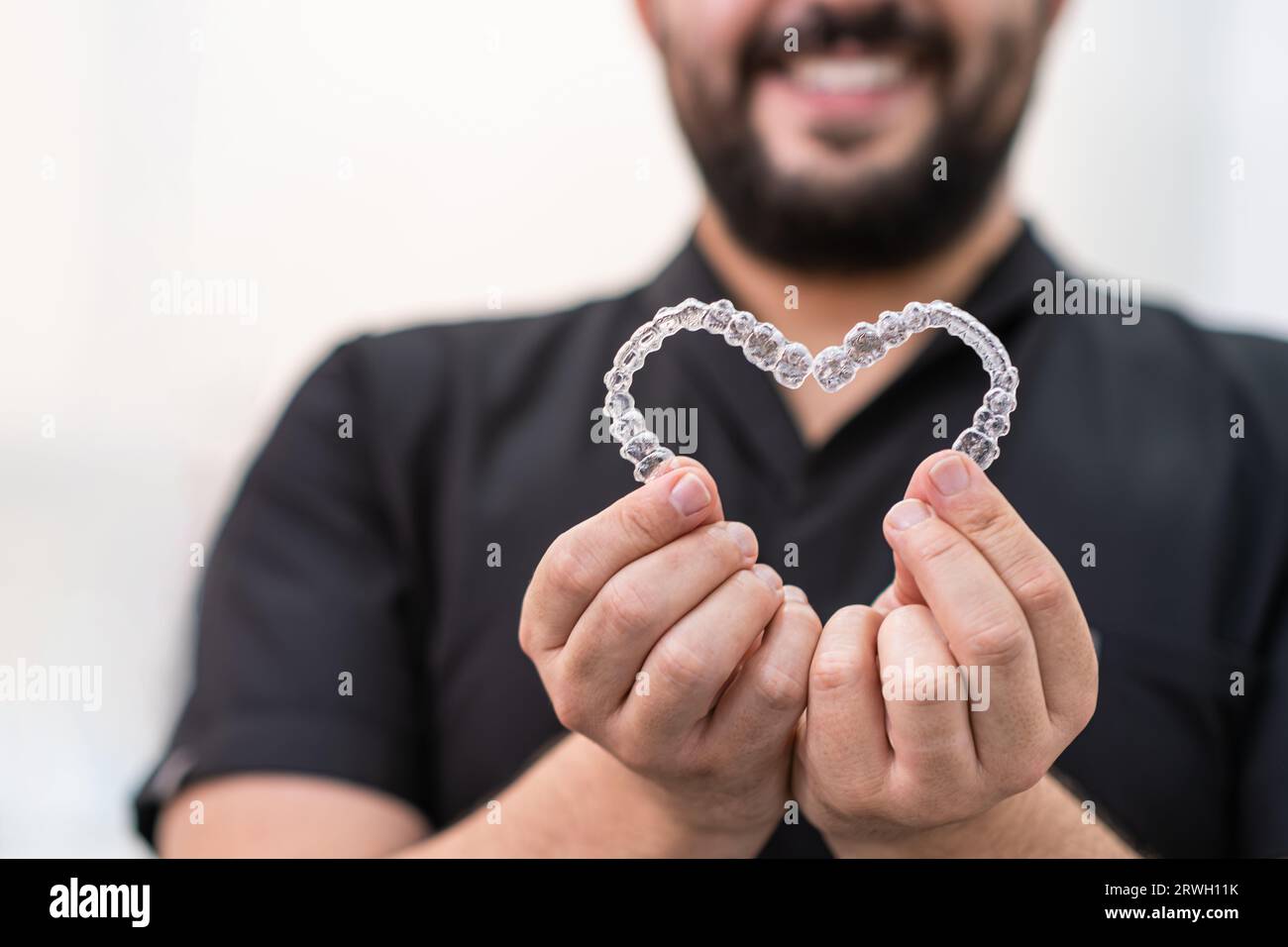 Man smiling holding clear plastic hi-res stock photography and images ...