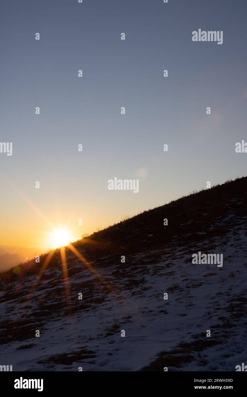 Beautiful sunset over snowy mountains hi-res stock photography and ...
