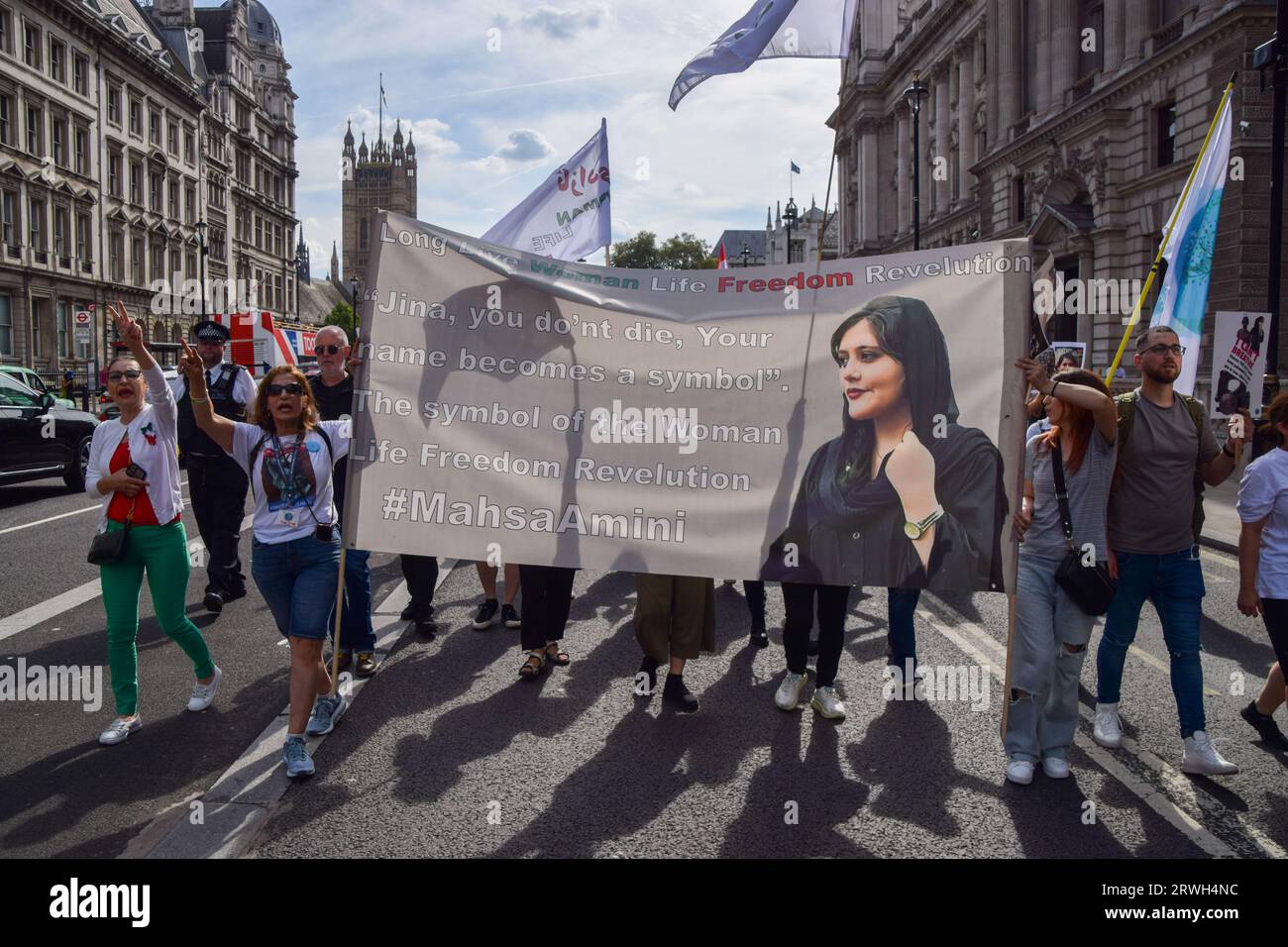 London, UK. 16th September 2023. Protesters march in Whitehall. British Iranians held several protests around London against the Iran regime to mark the anniversary of the death of Mahsa Amini, as well as the protests and the government crackdown which followed in Iran. Stock Photo