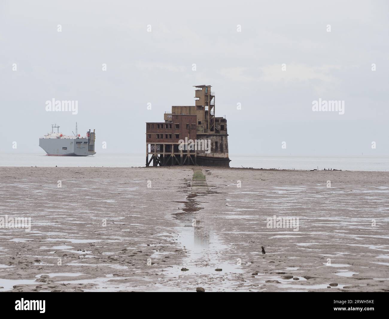 Sheerness, Kent, UK. 19th Sep, 2023. [FILE PIC from Mar 2020] Unique property 'No 1 The Thames' is to be sold at auction by Savills tomorrow guide price £150,000, otherwise known as Grain Tower - a mid 19century gun tower set off the Isle of Grain, at the mouth of the Medway and opposite the Port of Sheerness. FILE PIC: showing the causeway from the Isle of Grain. Credit: James Bell/Alamy Live News Stock Photo