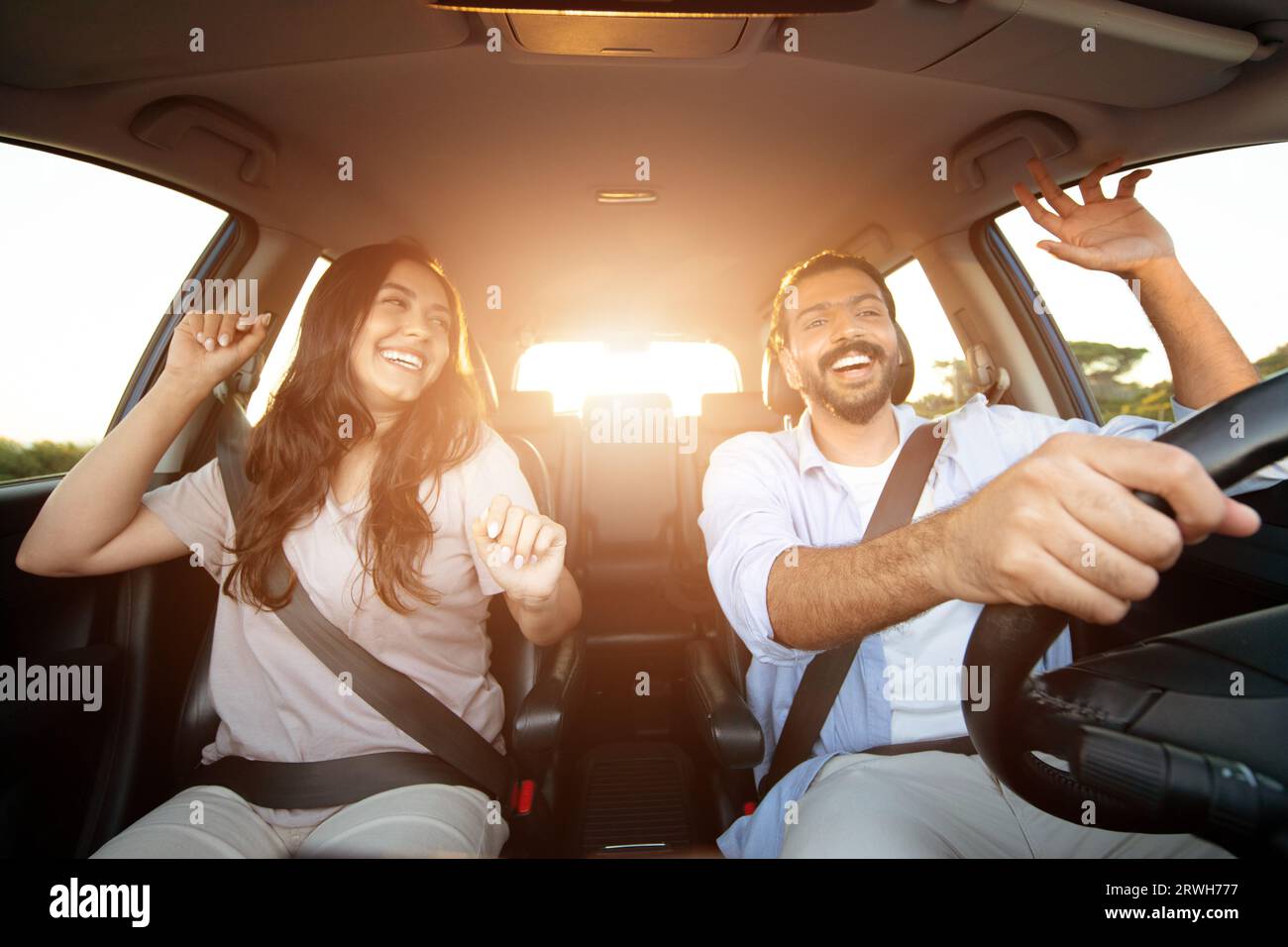 Active leisure, car trip concept. Positive latin couple having fun ...