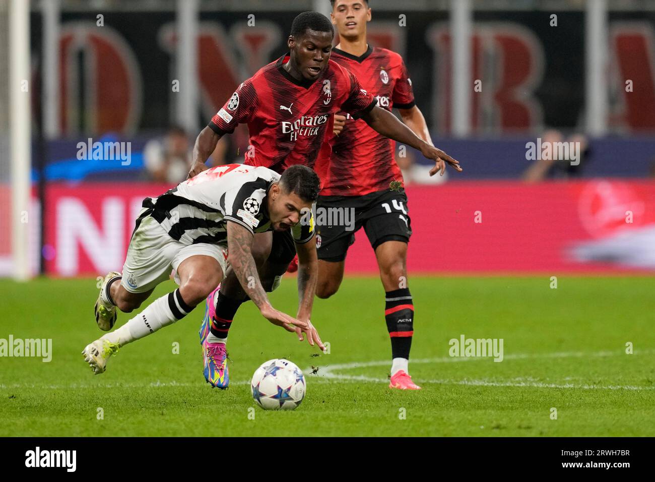 Newcastle's Bruno Guimaraes, left, challenges for the ball with AC Milan's  Yunus Musah during the Champions League group F soccer match between AC  Milan and Newcastle at the San Siro stadium in