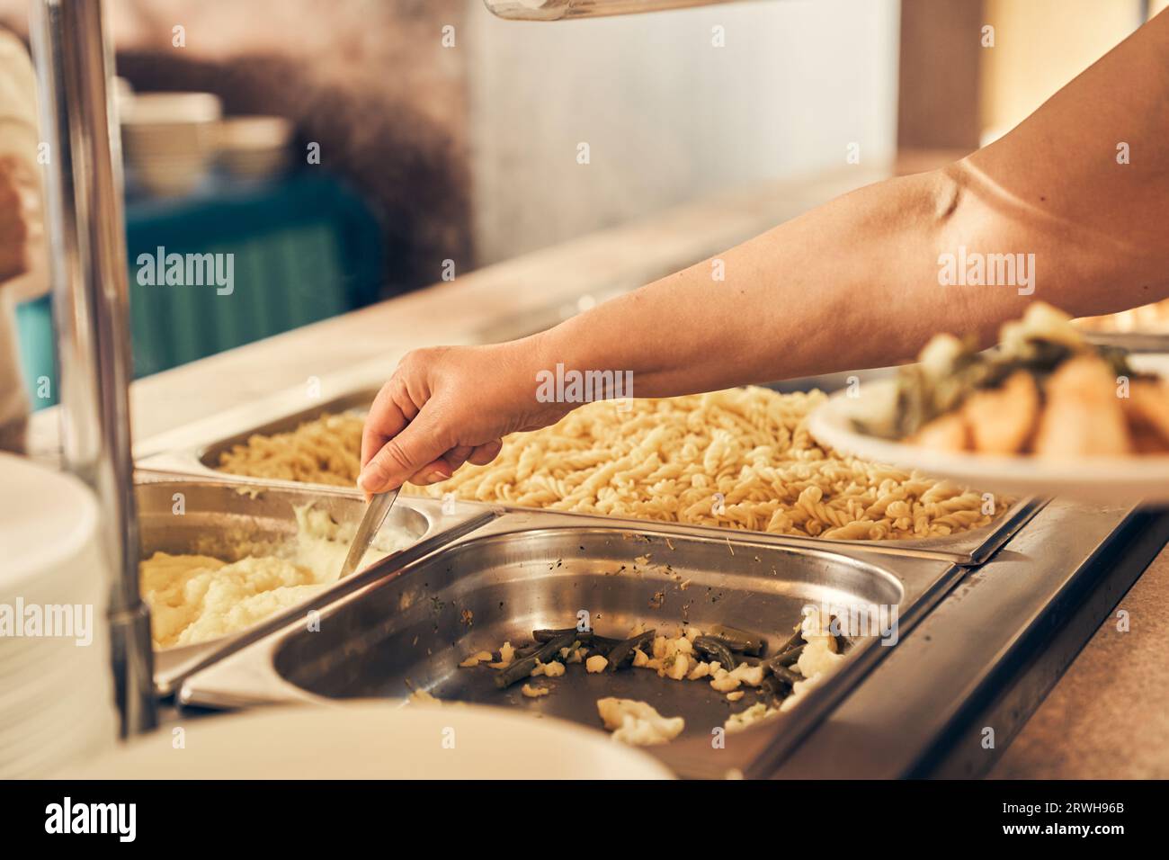 A hand serving food to the homeless. People receiving donations from a good friend, the concept of careful giving. High quality photo Stock Photo
