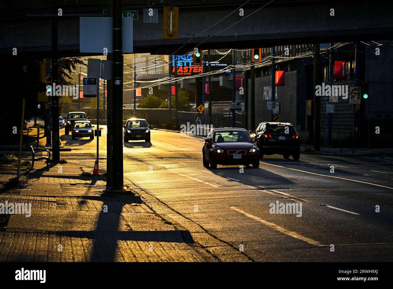 Traffic at sunset, Powell Street, Vancouver, British Columbia,  Canada Stock Photo