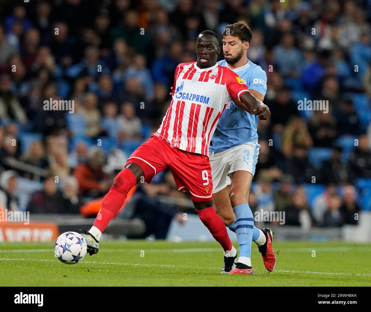 MANCHESTER, UK. 19th Sep, 2023. Cherif Ndiaye of Red Star Belgrade tussles with Ruben Dias of Manchester City during the UEFA Champions League match at the Etihad Stadium, Manchester. Picture credit should read: Andrew Yates/Sportimage Credit: Sportimage Ltd/Alamy Live News Stock Photo