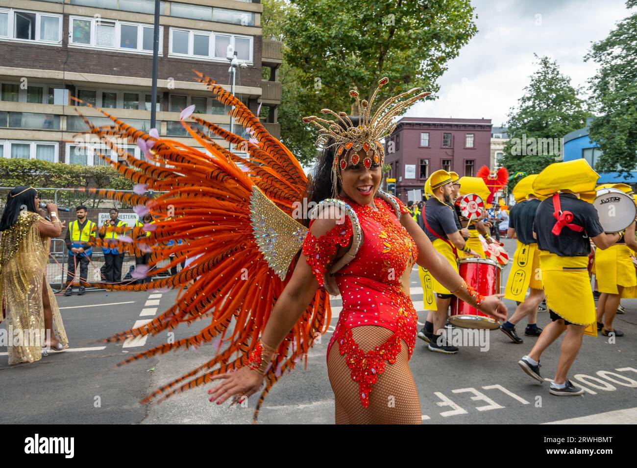 NOTTING HILL LONDON ENGLAND 28 August 2023 Woman Wearing A Costume notting-hill-london-england-28-august-2023-woman-wearing-a-costume