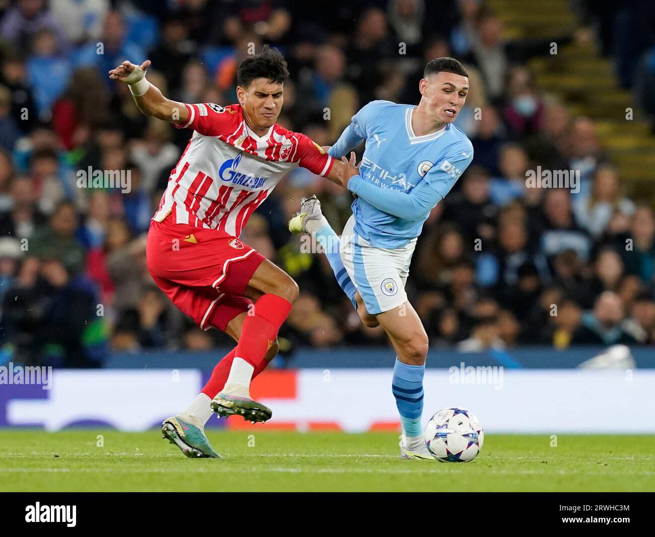MANCHESTER, UK. 19th Sep, 2023. Marko Stamenic of Red Star Belgrade tussles with Phil Foden of Manchester City during the UEFA Champions League match at the Etihad Stadium, Manchester. Picture credit should read: Andrew Yates/Sportimage Credit: Sportimage Ltd/Alamy Live News Stock Photo