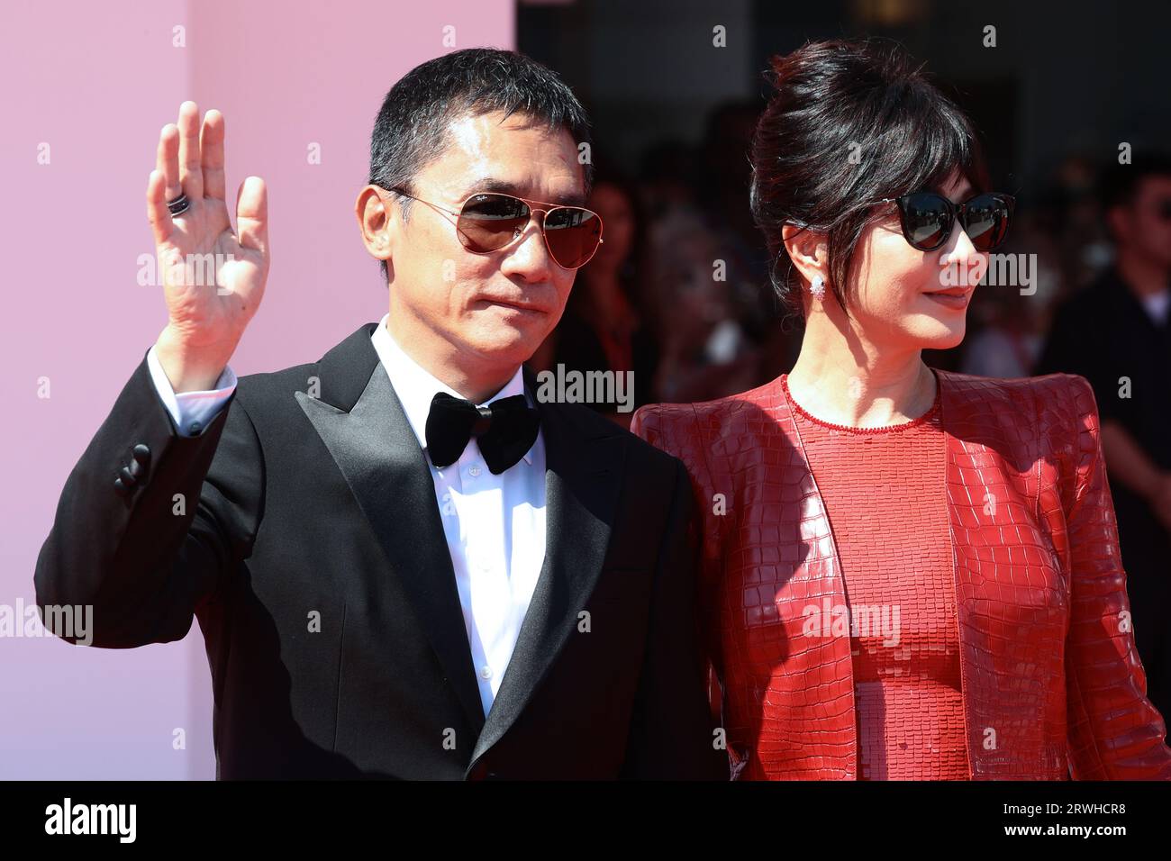 VENICE, ITALY - SEPTEMBER 02: Tony Leung Chiu-Wai and Carina Lau Kar-ling attends a red carpet for the Golden Lion For Lifetime Achievement Stock Photo