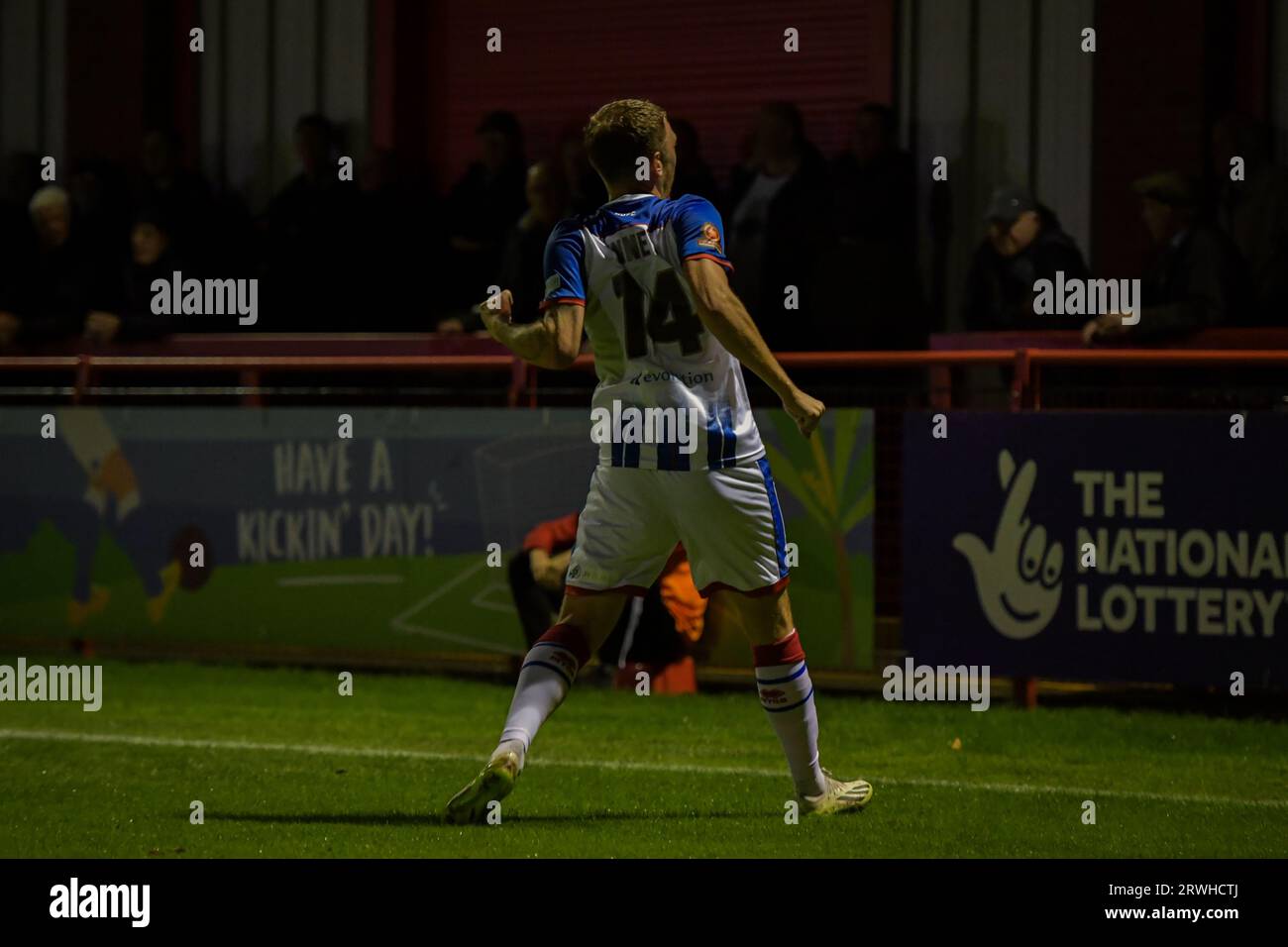 Tom Peers of Altricham in action with Claudio Ofosu of Hartlepool