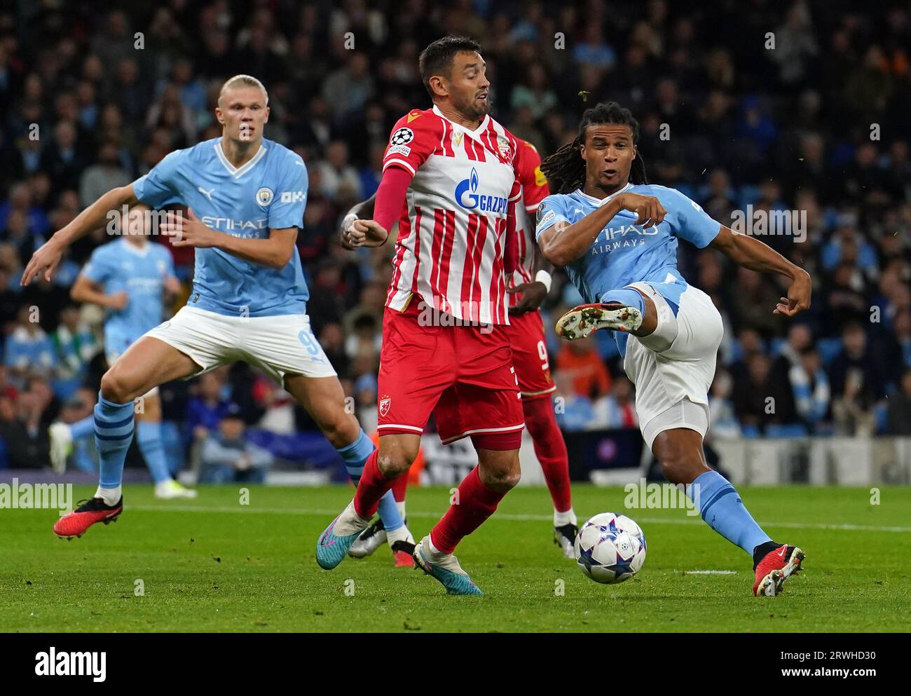 Manchester City's Nathan Ake (right) attempts a shot on goal during the UEFA Champions League Group G match at the Etihad Stadium, Manchester. Picture date: Tuesday September 19, 2023. Stock Photo