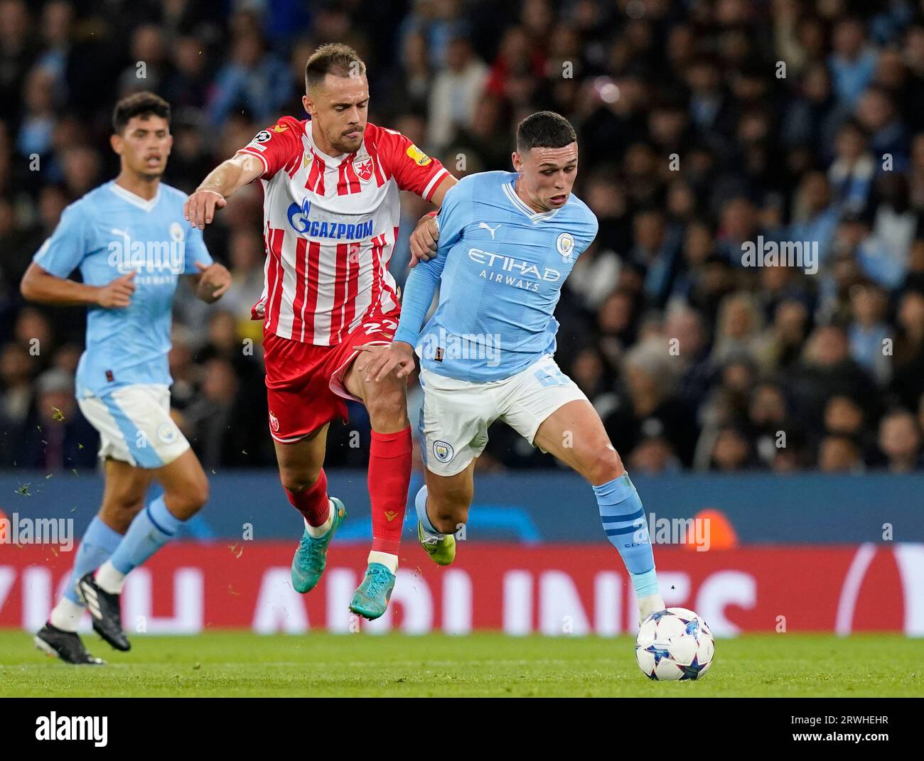 MANCHESTER, UK. 19th Sep, 2023. Milan Rodic of Red Star Belgrade challenges Phil Foden of Manchester City during the UEFA Champions League match at the Etihad Stadium, Manchester. Picture credit should read: Andrew Yates/Sportimage Credit: Sportimage Ltd/Alamy Live News Stock Photo