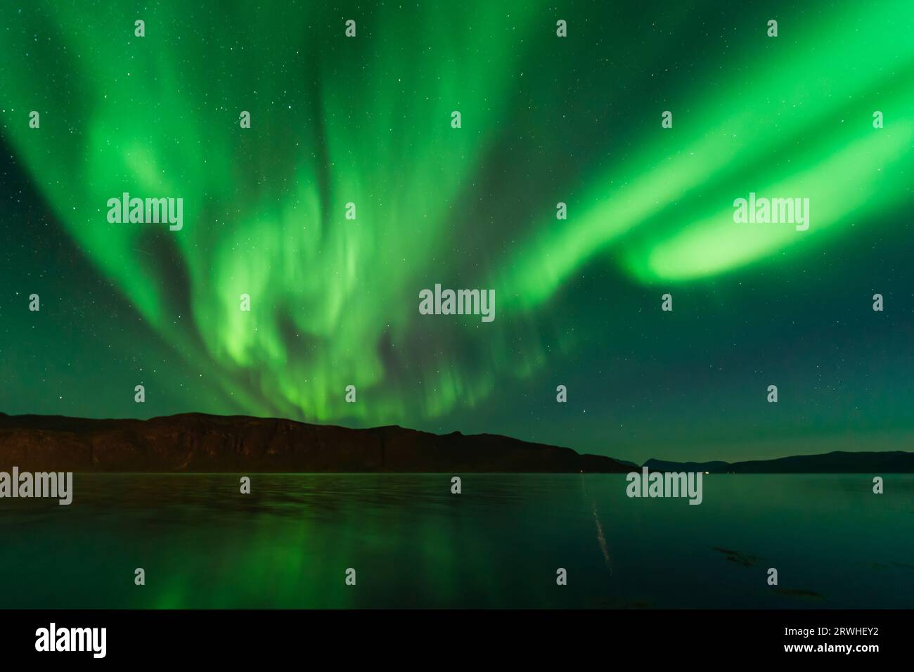 Northern Lights also known as Aurora Borealis over Scandinavia in Northern Norway Stock Photo