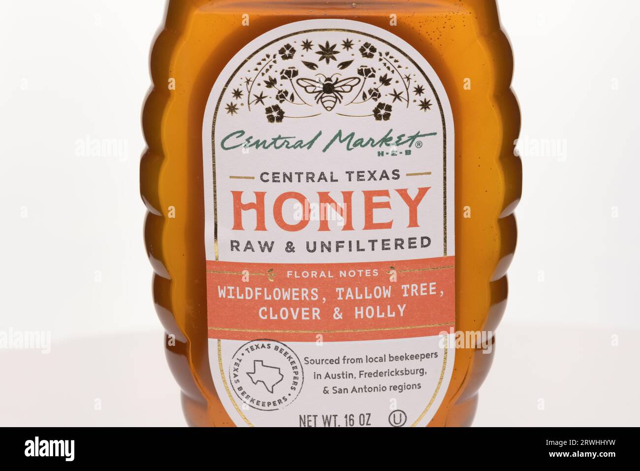 Fresh honey sourced from local Texas beekeepers and honey bees collecting pollen from Texas flora Stock Photo