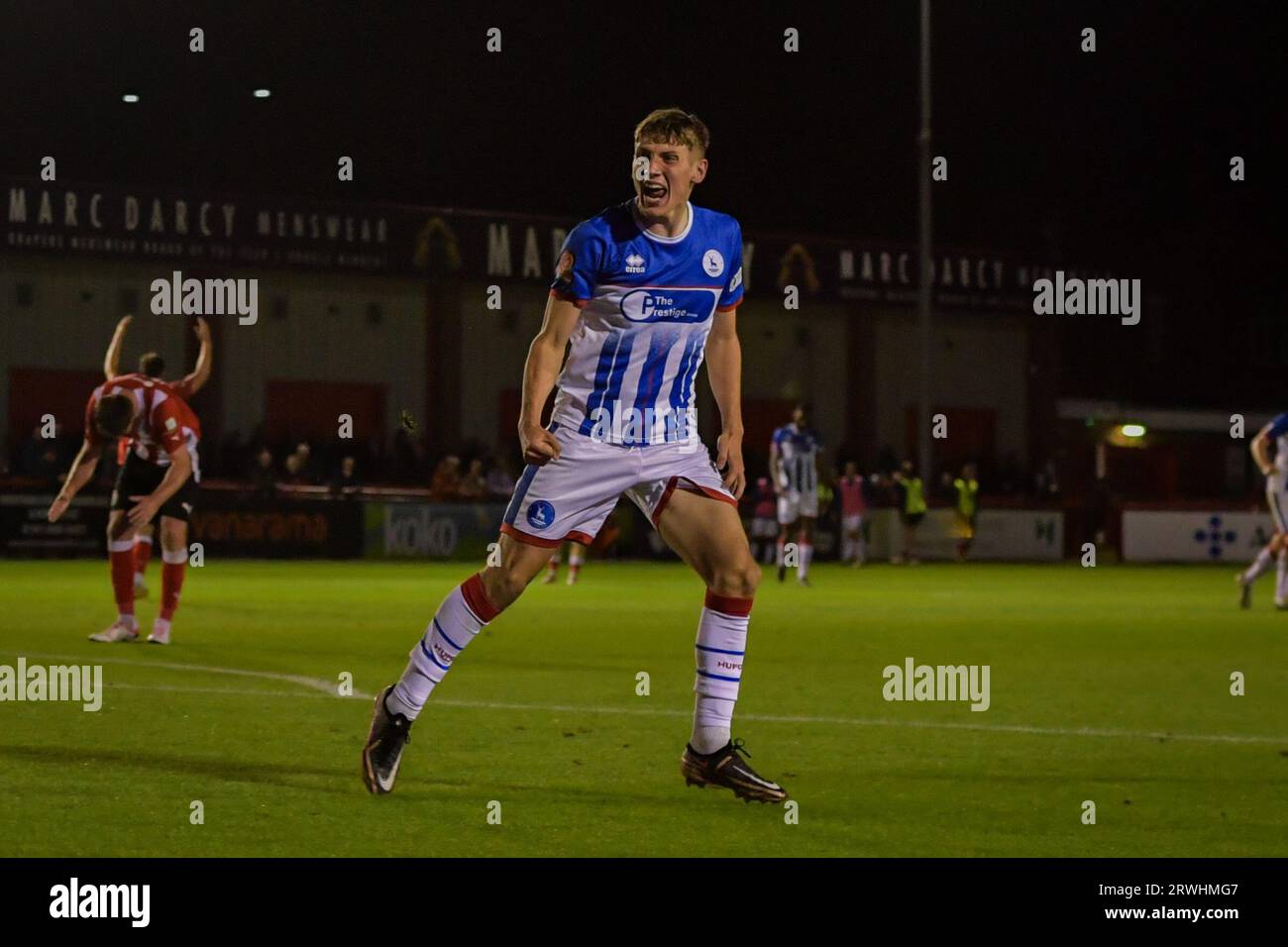 Tom Peers of Altricham in action with Claudio Ofosu of Hartlepool