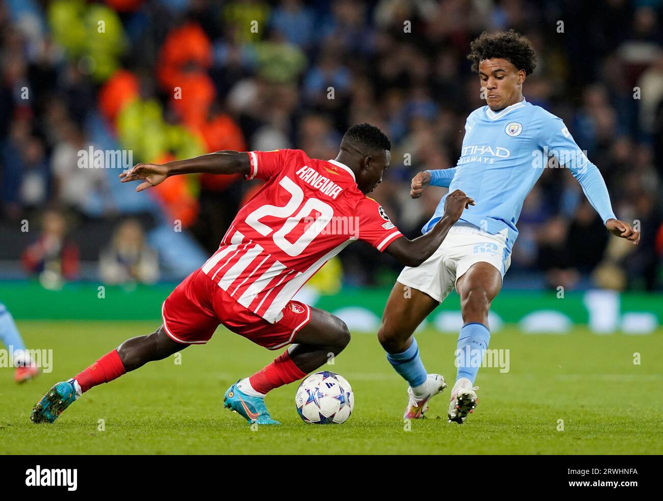 MANCHESTER, UK. 19th Sep, 2023. Kings Kangwa of Red Star Belgrade tackled by Oscar Bobb of Manchester City during the UEFA Champions League match at the Etihad Stadium, Manchester. Picture credit should read: Andrew Yates/Sportimage Credit: Sportimage Ltd/Alamy Live News Stock Photo