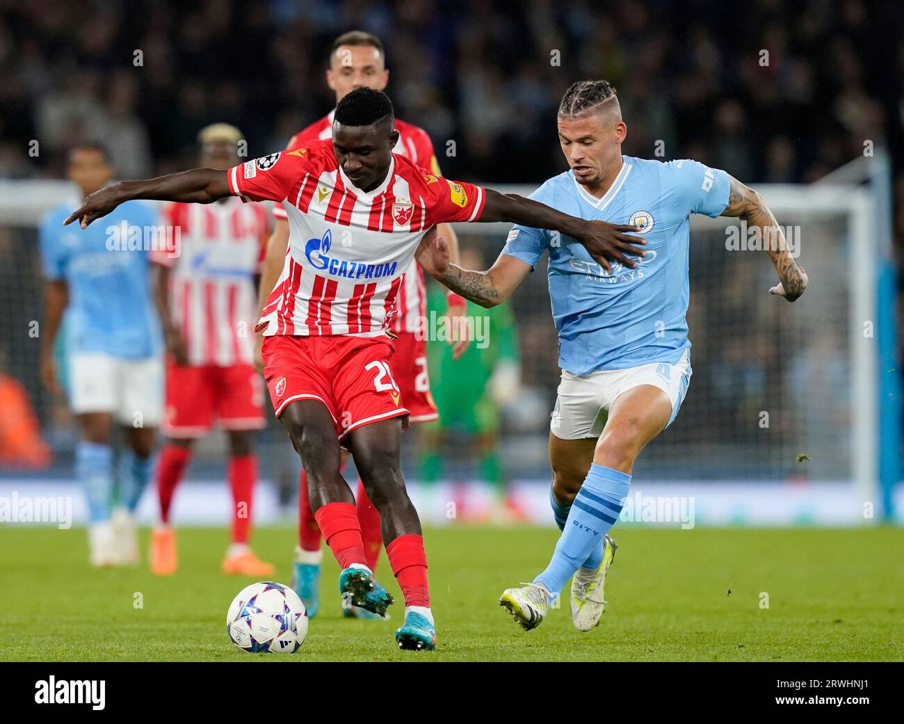 MANCHESTER, UK. 19th Sep, 2023. Kings Kangwa of Red Star Belgrade and Kalvin Phillips of Manchester City during the UEFA Champions League match at the Etihad Stadium, Manchester. Picture credit should read: Andrew Yates/Sportimage Credit: Sportimage Ltd/Alamy Live News Stock Photo