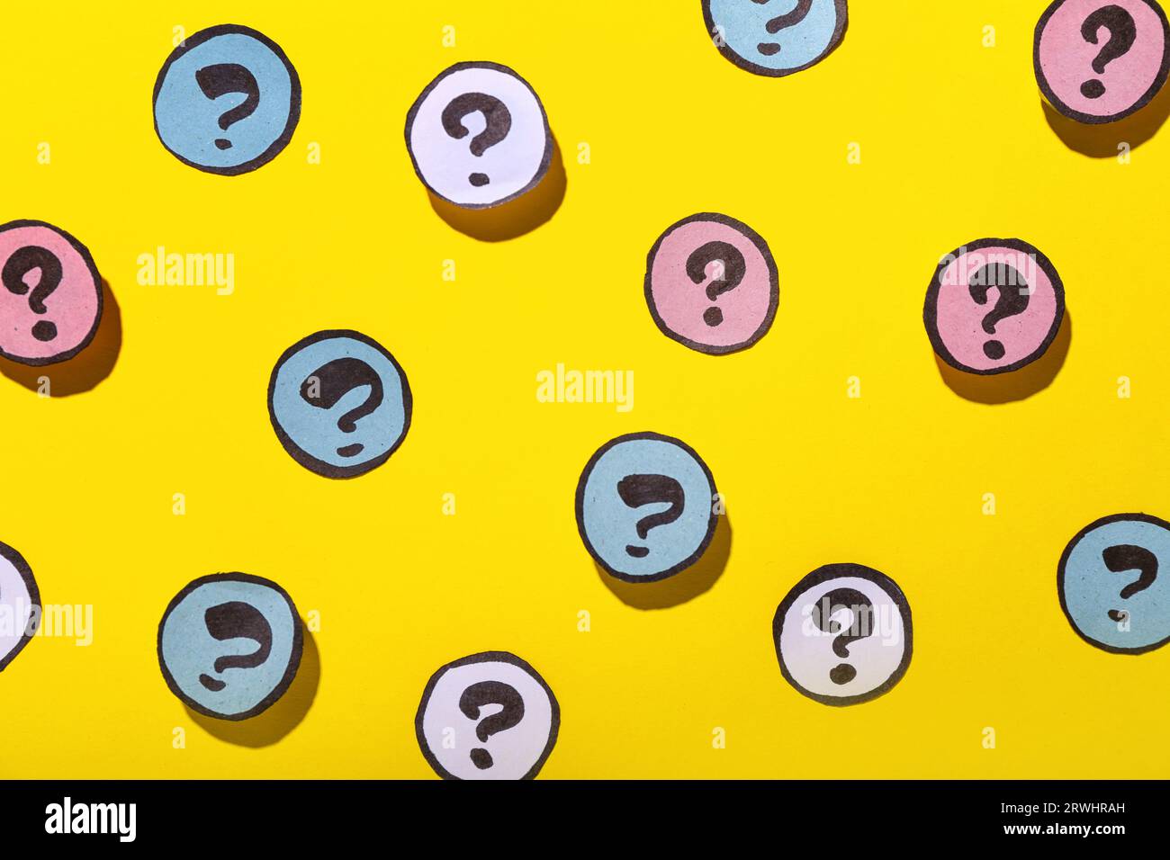 Different question marks on yellow background Stock Photo