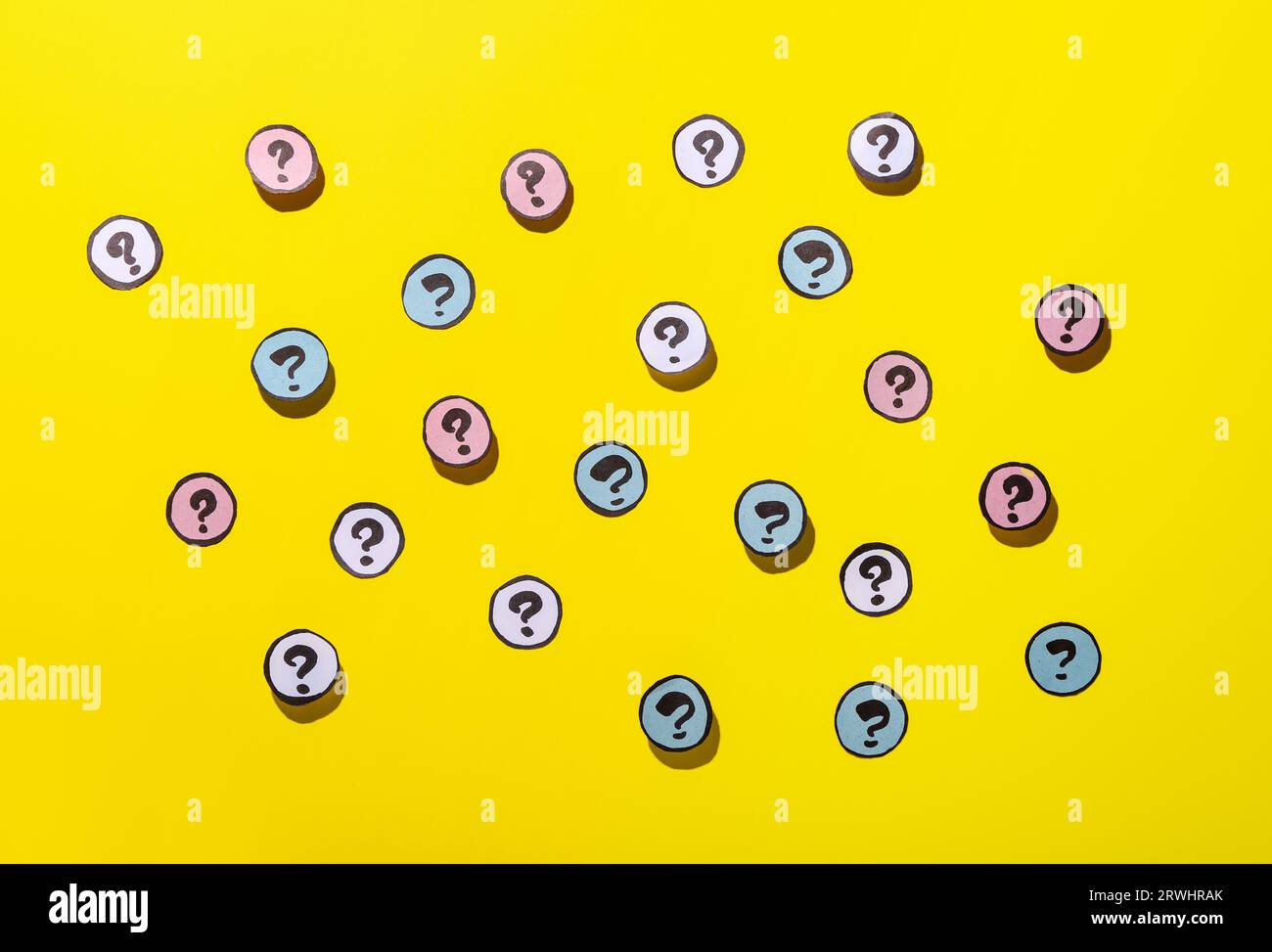 Different question marks on yellow background Stock Photo - Alamy
