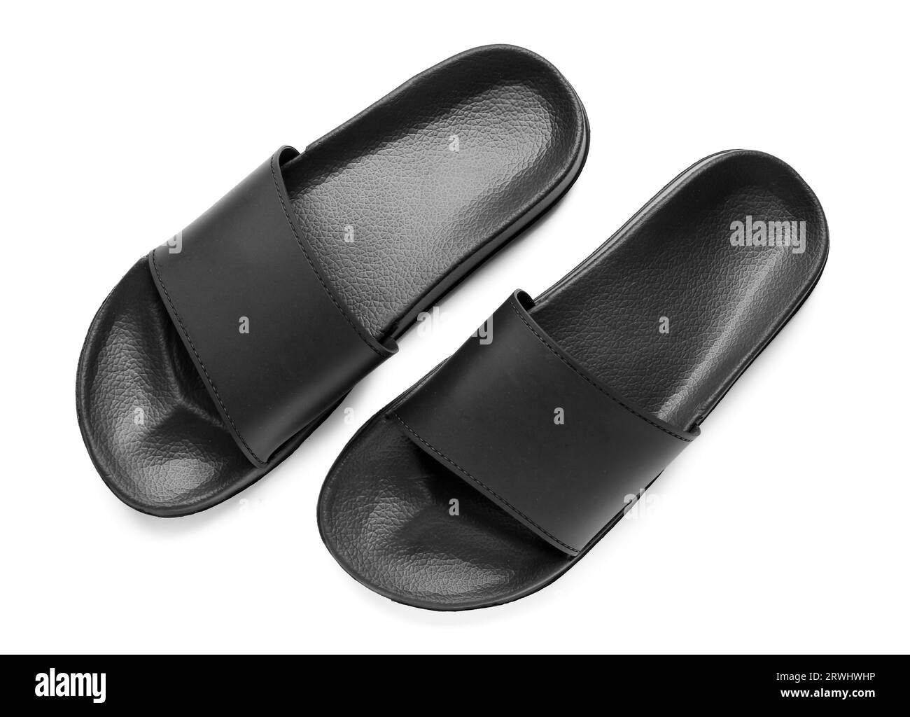 Black female flip flops on white background Stock Photo - Alamy