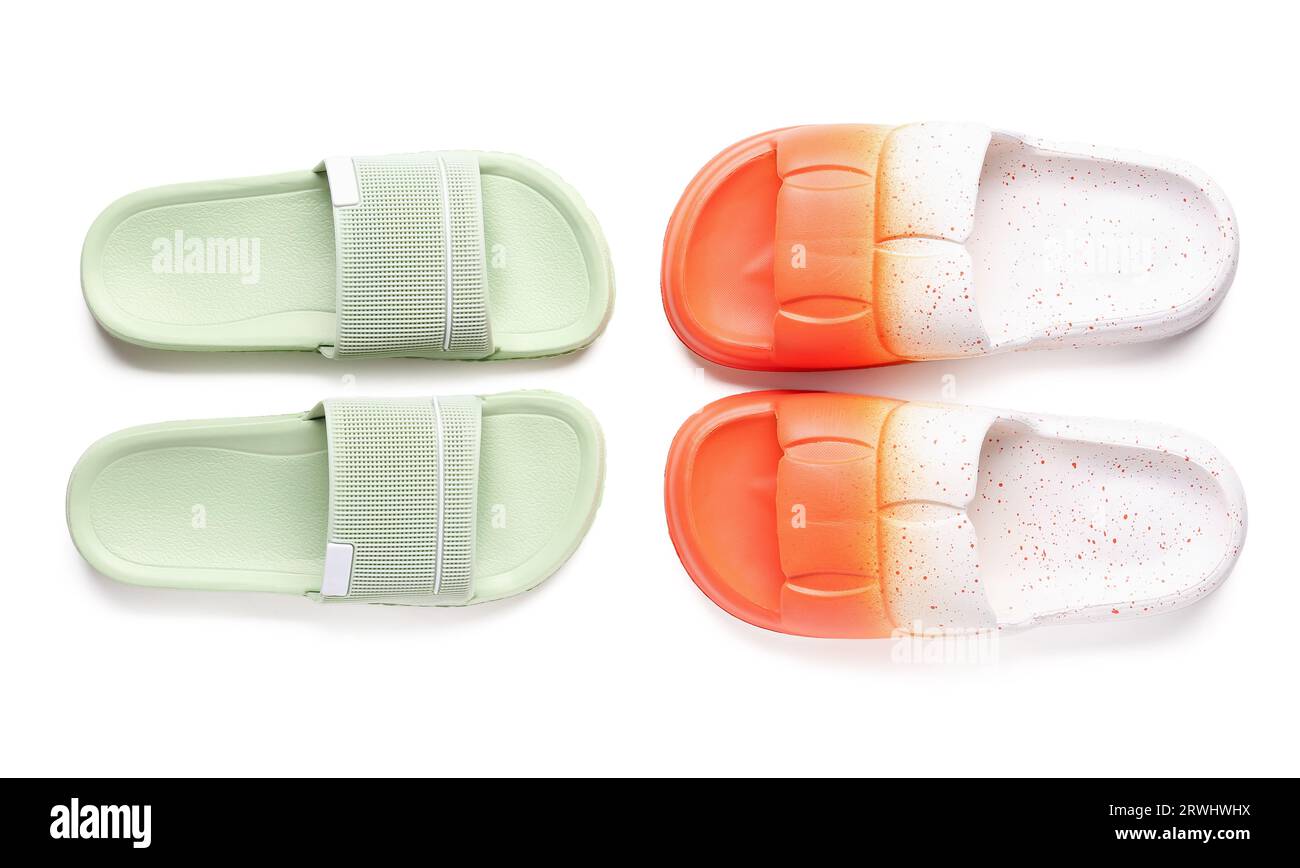Colorful pairs of female flip flops on white background Stock Photo - Alamy