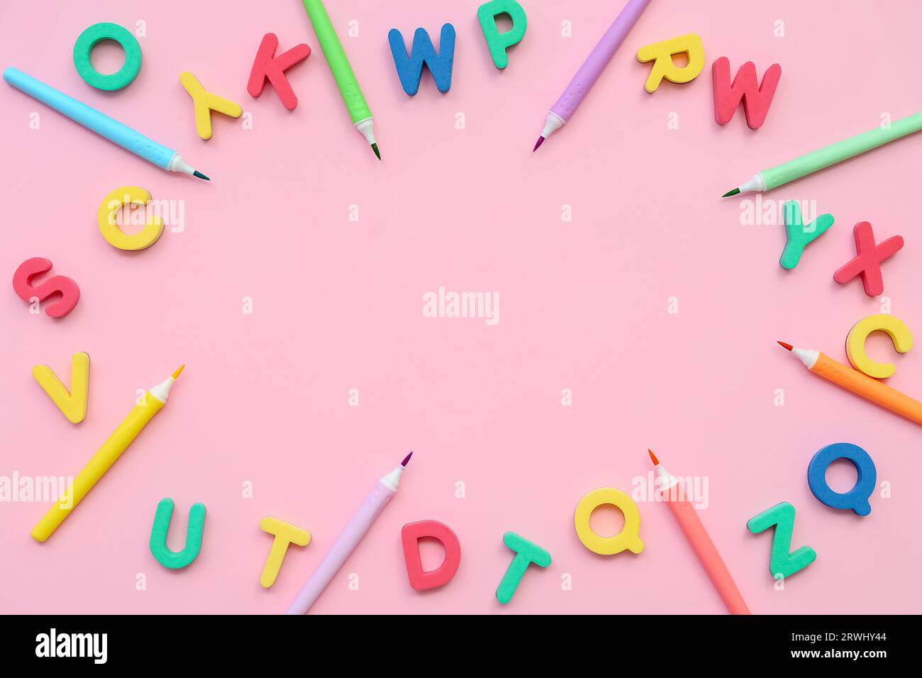 Letter Frame Colorful Frame made of colorful letters and felt-tip pens on pink background ...