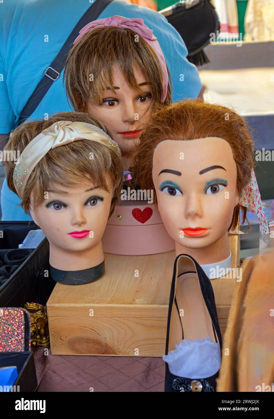 Female mannequins heads used to present fashion accessories sold on
