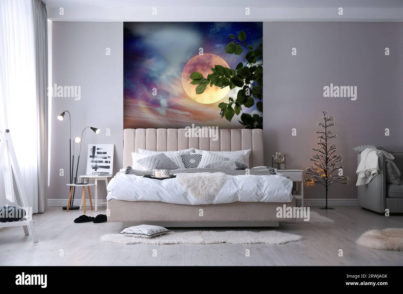 https://c8.alamy.com/comp/2RWJAGK/light-bedroom-interior-with-comfortable-bed-and-beautiful-wallpapers-2RWJAGK.jpg