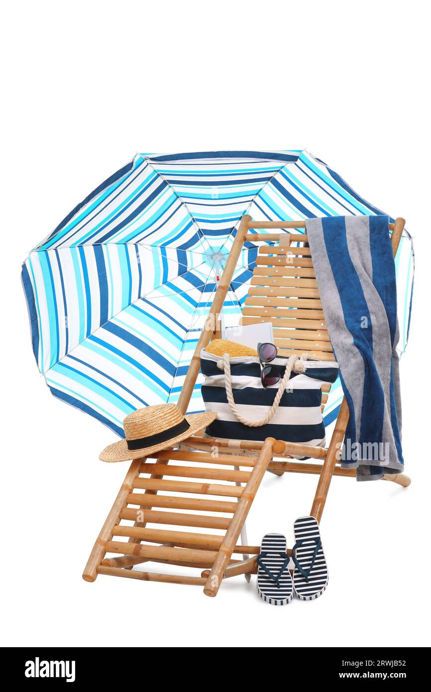 Deck chair, umbrella and other beach accessories isolated on white ...